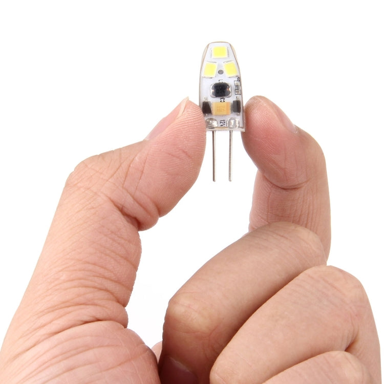 6 LED SMD 2835 silicone module held in hand, two pins exposed