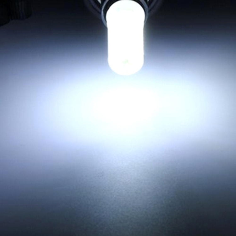 Dimmable LED plug bulb emitting white light glow from clear two-pin base