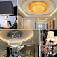 Ceiling chandelier and pendant light fixtures with warm amber glow in a room