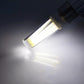 Dimmable E14 LED bulb emitting bright white light from clear glass tube