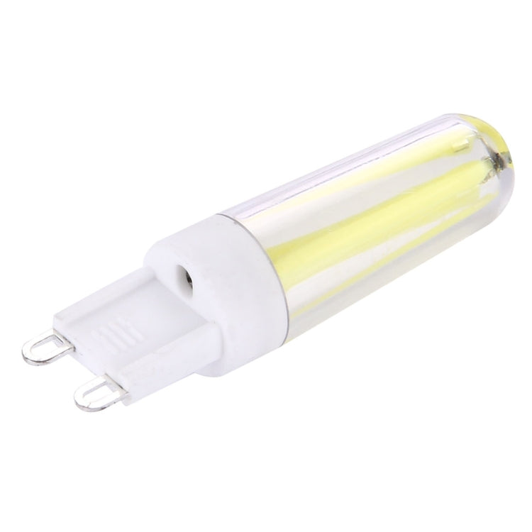 G9 dimmable LED lamp, side view, clear glass tube with white base and pin connectors