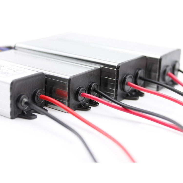 LED driver terminal end with four screw posts and red wiring leads