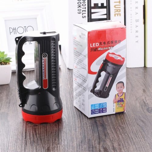 Black and red LED flashlight standing with retail packaging box