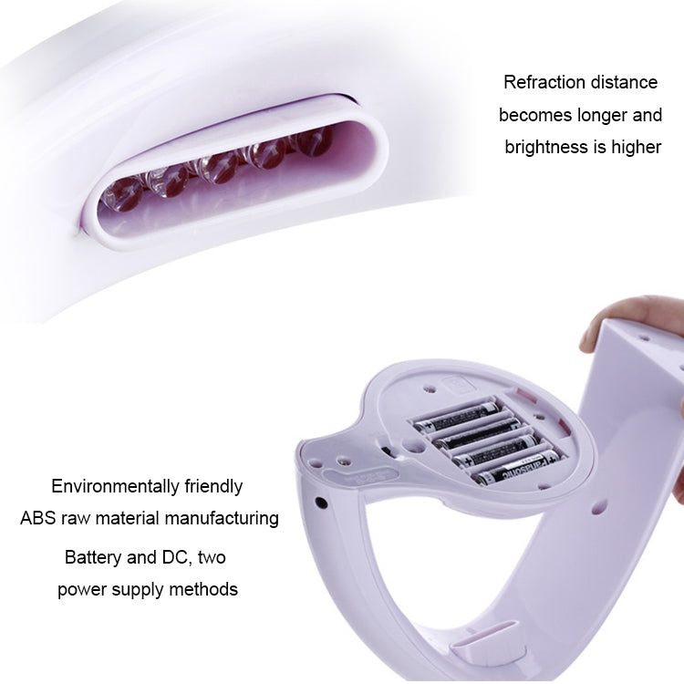White LED night light lamp with open projector window and exposed battery compartment