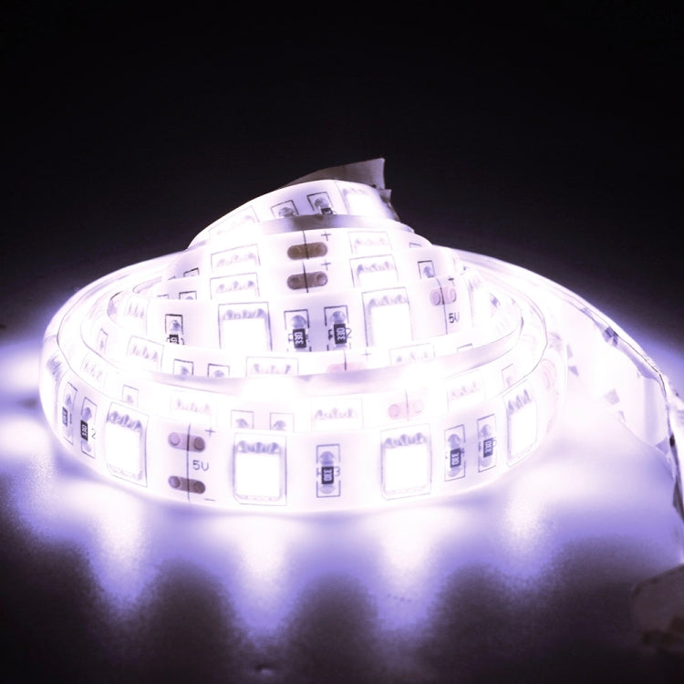 Lit waterproof LED strip light with 30 SMD LEDs showing bright white glow