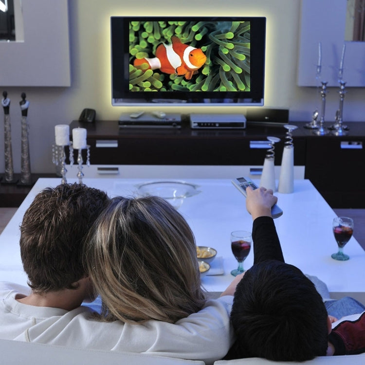 Waterproof LED strip light behind TV setup, glowing around screen area