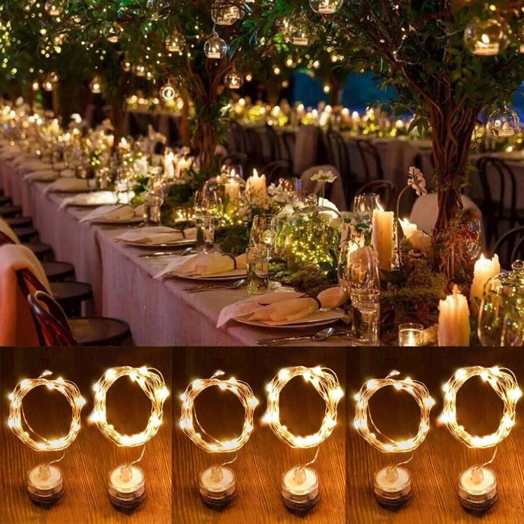Warm white LED rope fairy lights shaped into glowing circular loops with bases