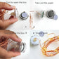 LED fairy light rope components: clear bulb caps and copper wire with hands assembling