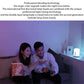White bedside night light lamp glowing in blue and purple ambient light