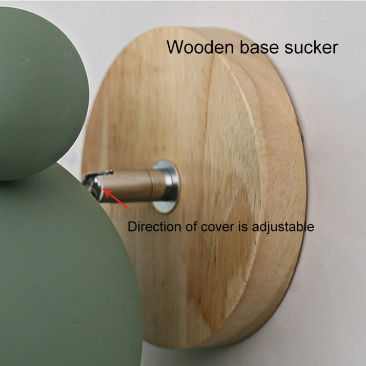Adjustable wall lamp on round wooden base with cone holder and included adjustment hardware.