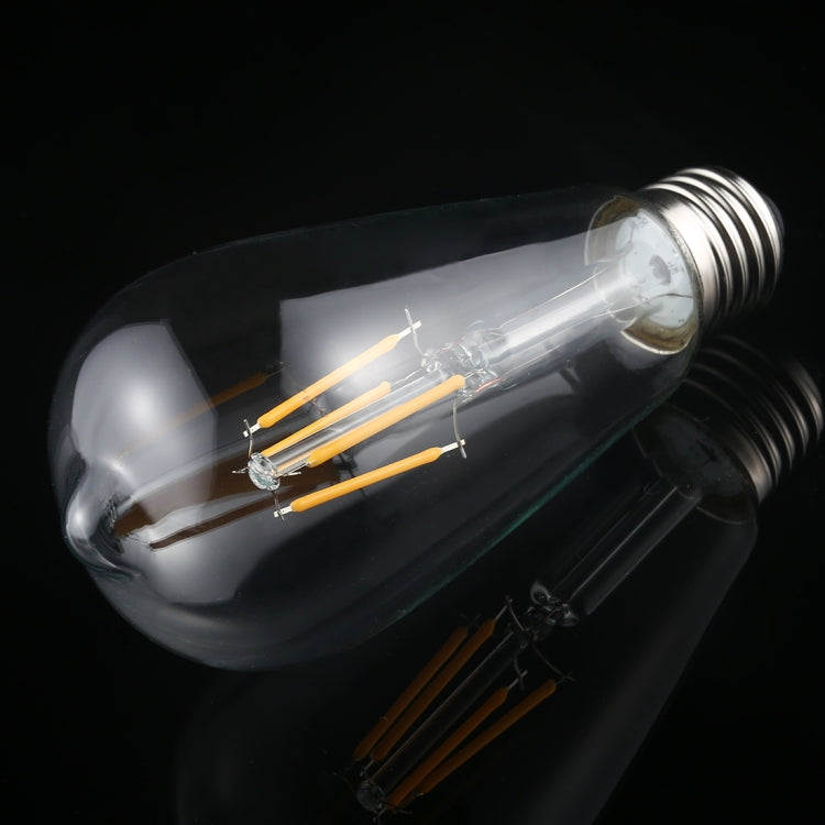 ST64 LED filament bulb with warm-white glowing filaments and E27 screw base.