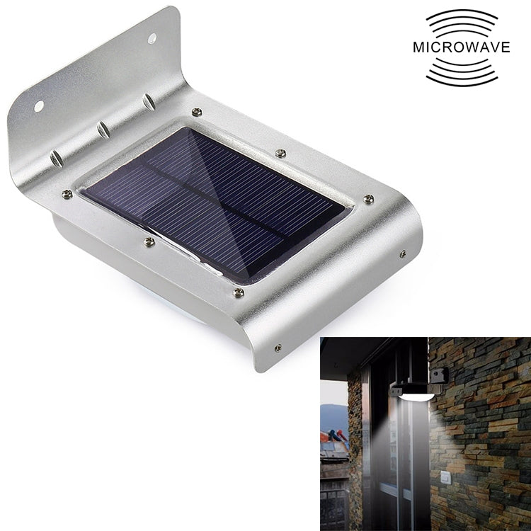 Silver solar wall light with hinged mounting bracket and blue solar panel