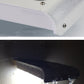 White solar wall light close-up of underside LED area and metal mounting screws