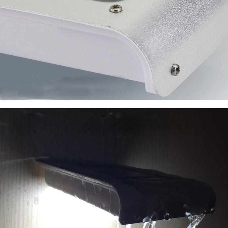 White solar wall light close-up of underside LED area and metal mounting screws