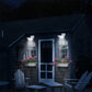 Outdoor solar wall lights mounted on house exterior at night