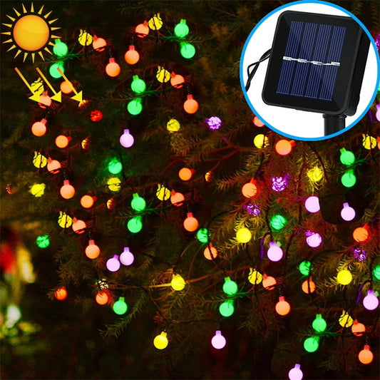 Outdoor solar LED string with round multi-color bulbs and small top solar panel