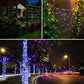 Outdoor LED string lights on fence and building walls at night