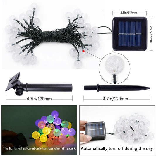 Solar LED bubble ball string lights set with clear globe bulbs, solar panel, and ground stake