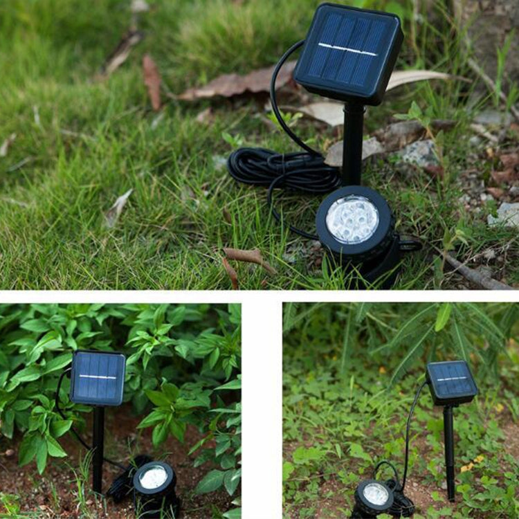 Outdoor solar LED spotlight with ground stake, small solar panel, and round light head