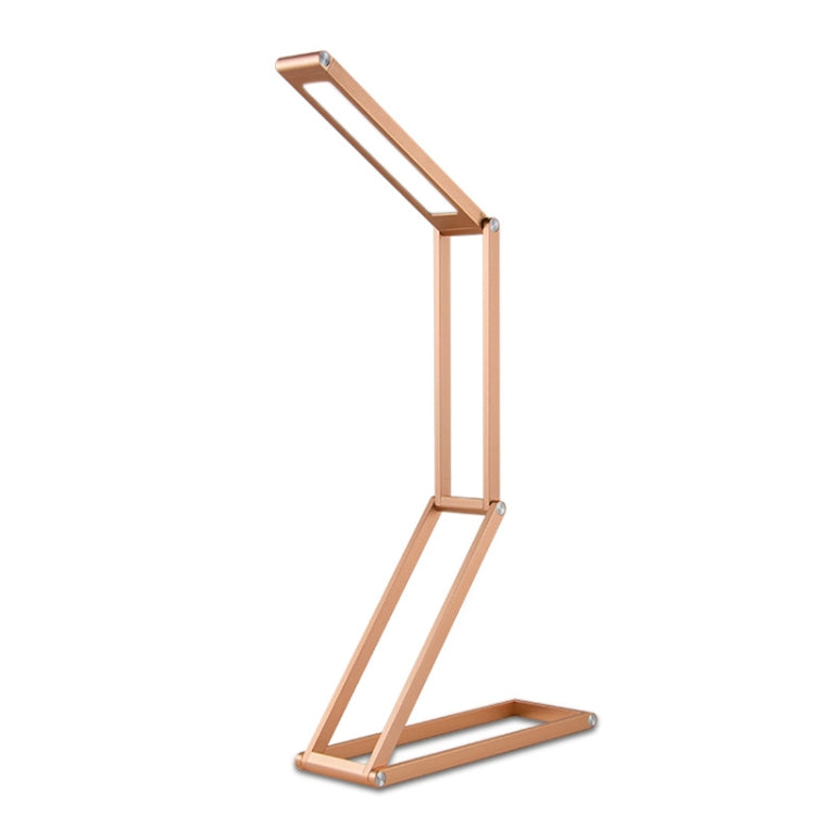 Folding LED desk lamp with tall frame and hinged base, light wood finish