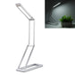 Silver folding LED desk lamp with adjustable head and USB charging base