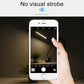 White LED desk lamp controlled by hand on a smartphone screen; no visible strobe.