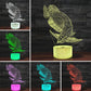 Fish-shaped 3D LED table lamp showing multicolor glow bases: green, purple, blue, red