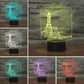 Lighthouse-shaped 3D LED table lamp showing multicolor outline glow on black base