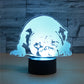 Glowing 3D dog-shaped LED table lamp on a black cylindrical base