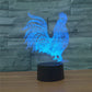 Glowing blue 3D rooster LED night light on cylindrical black base