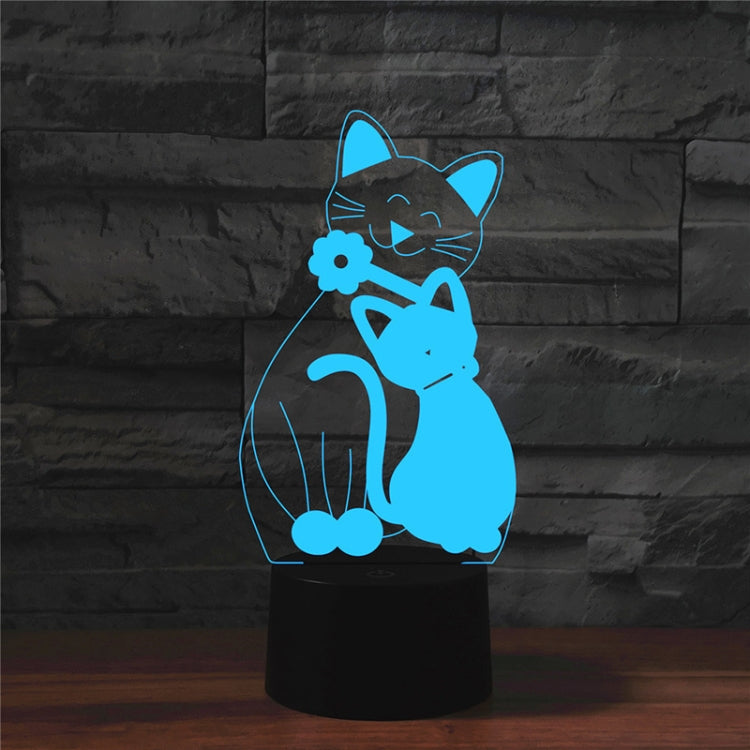 Blue cat-shaped 3D LED table lamp with flower detail on a black base