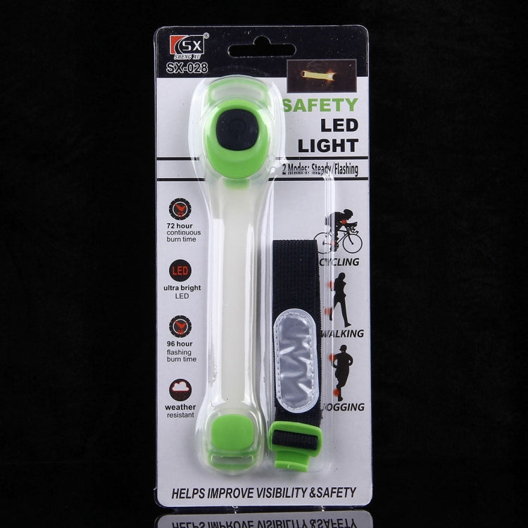 Retail package for green LED safety light wristband with black strap.