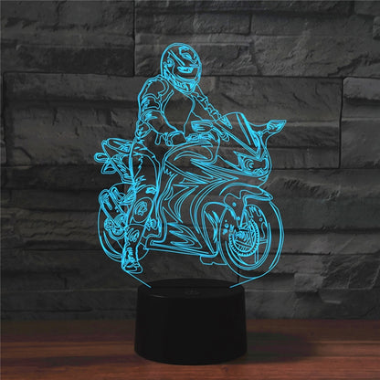 Motorcycle-shaped LED table lamp with blue glowing outline and black cylindrical base.