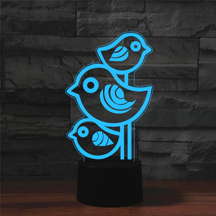 Blue three-bird LED table lamp with black base and light pillars