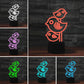 Three-bird LED table lamp shown in multiple colors on black base