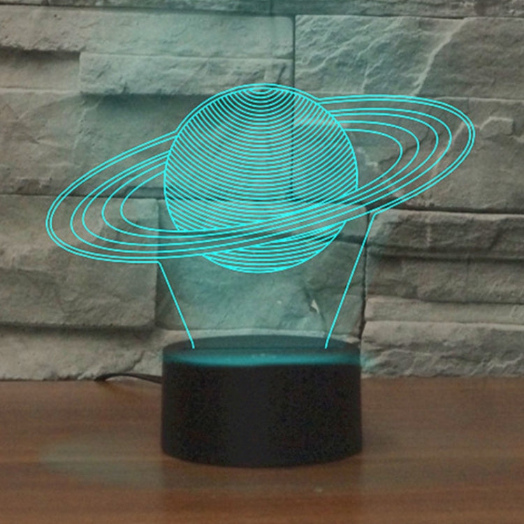 Colorful LED Saturn-shaped table lamp with blue orbit glow and black base