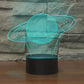 Colorful LED vision table lamp with Saturn swirl light projection and black base, blue glow