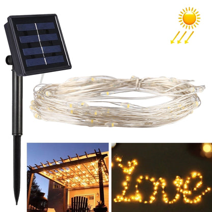 Solar fairy string light set with white wire and LED bulbs on a stake and panel