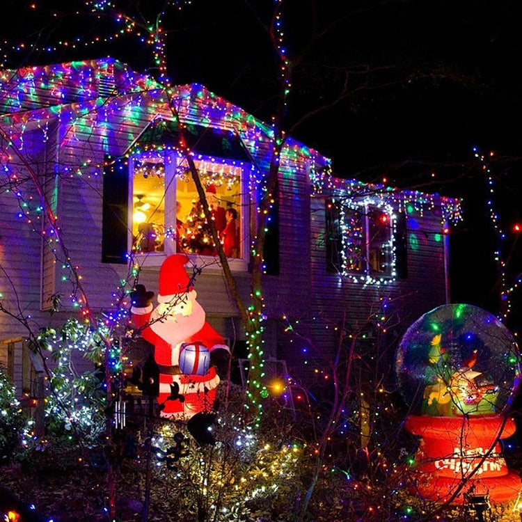 Colorful LED fairy string lights wrapped on outdoor railings and bushes