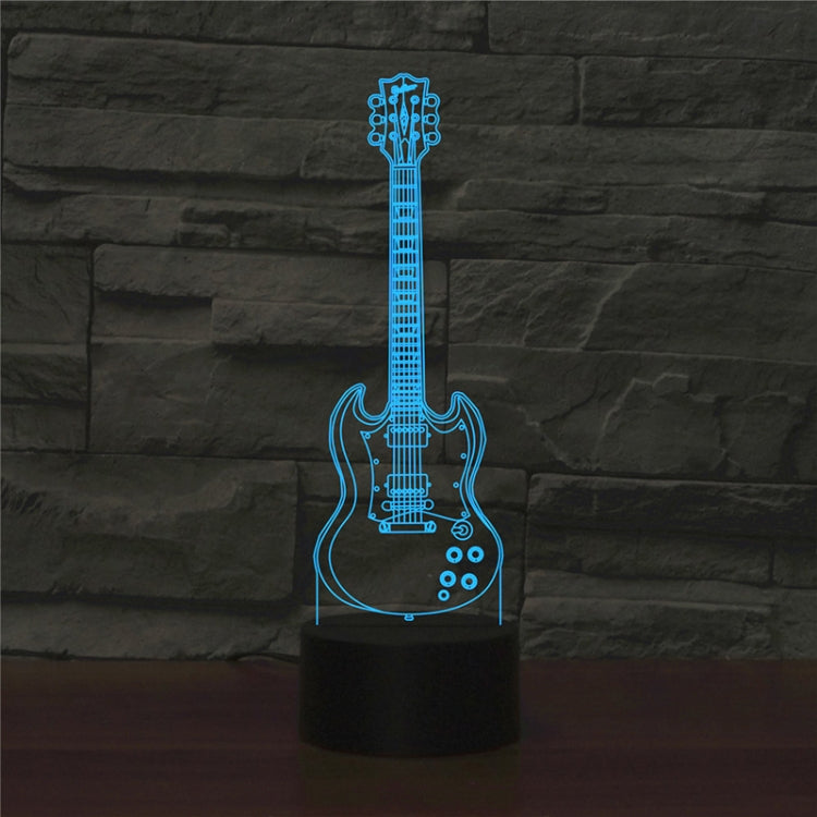 Front view of blue guitar-shaped LED table lamp on a black cylinder base.
