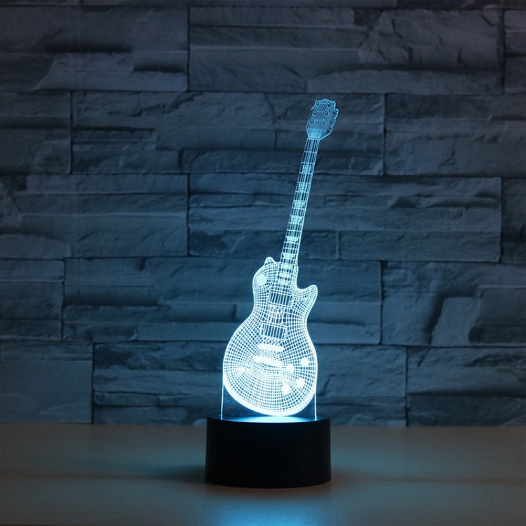 Blue LED guitar-shaped 3D table lamp with glowing grid and black round base