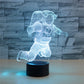 Astronaut 3D LED table lamp with blue glow and black cylindrical base