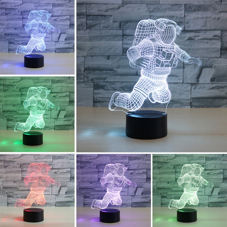 Astronaut 3D LED table lamp showing multi-color astronaut glow on a black base