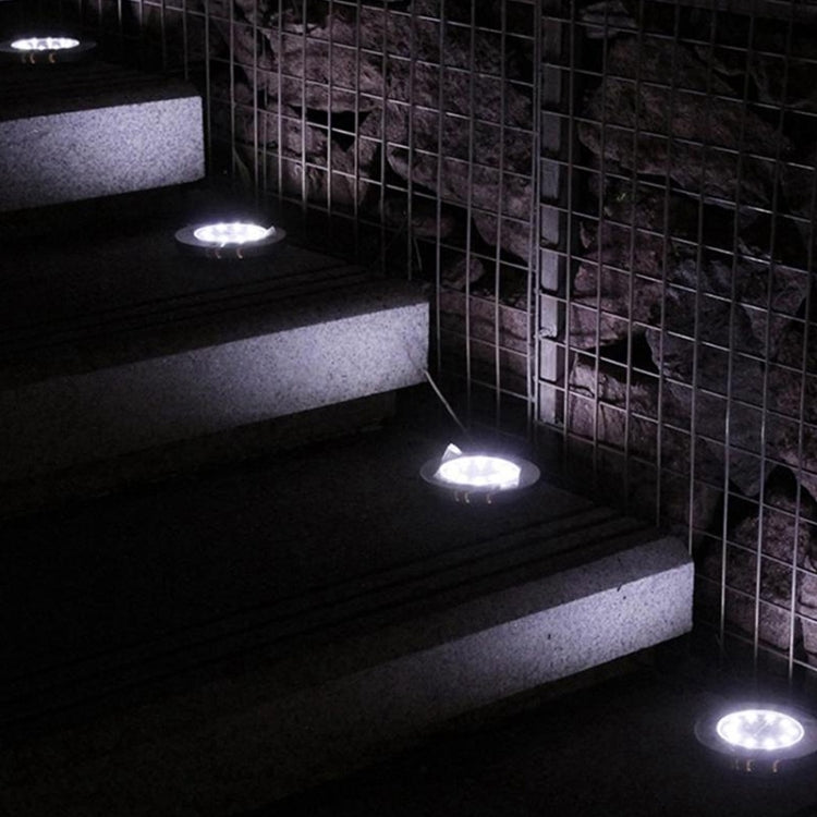 Solar ground LED lights illuminating walkway steps at night