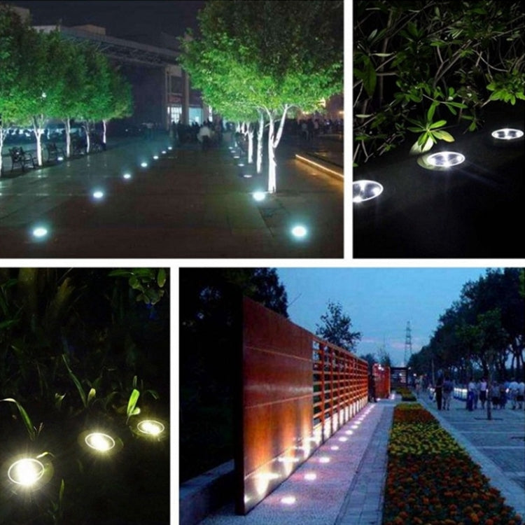 Solar LED buried ground lights lining a walkway with multiple small glowing discs