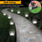 Solar buried ground lights illuminating a walkway with evenly spaced LED glow