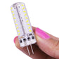 Hand holding clear G4 LED capsule bulb with white LED chips and two pins