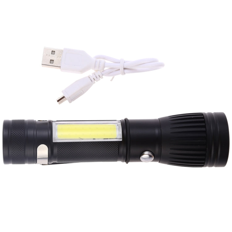 Black USB rechargeable LED torch flashlight with charging cable plugged in