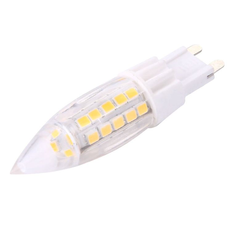 Side view of clear LED bulb with white base and 44 yellow SMD chips