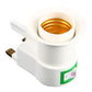 White E27 lamp holder adapter with brass socket insert and green rocker switch
